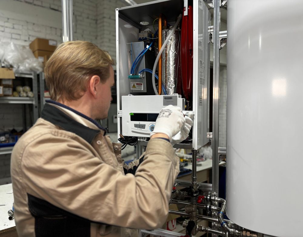 Technician installing and testing a new heating system