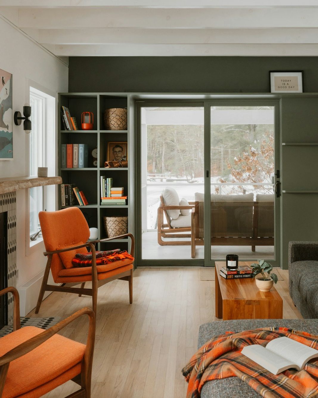 Bright, comfortable living room with a lit fireplace