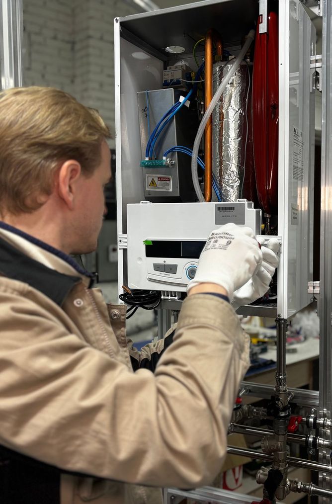 Technician installing and testing a heating system